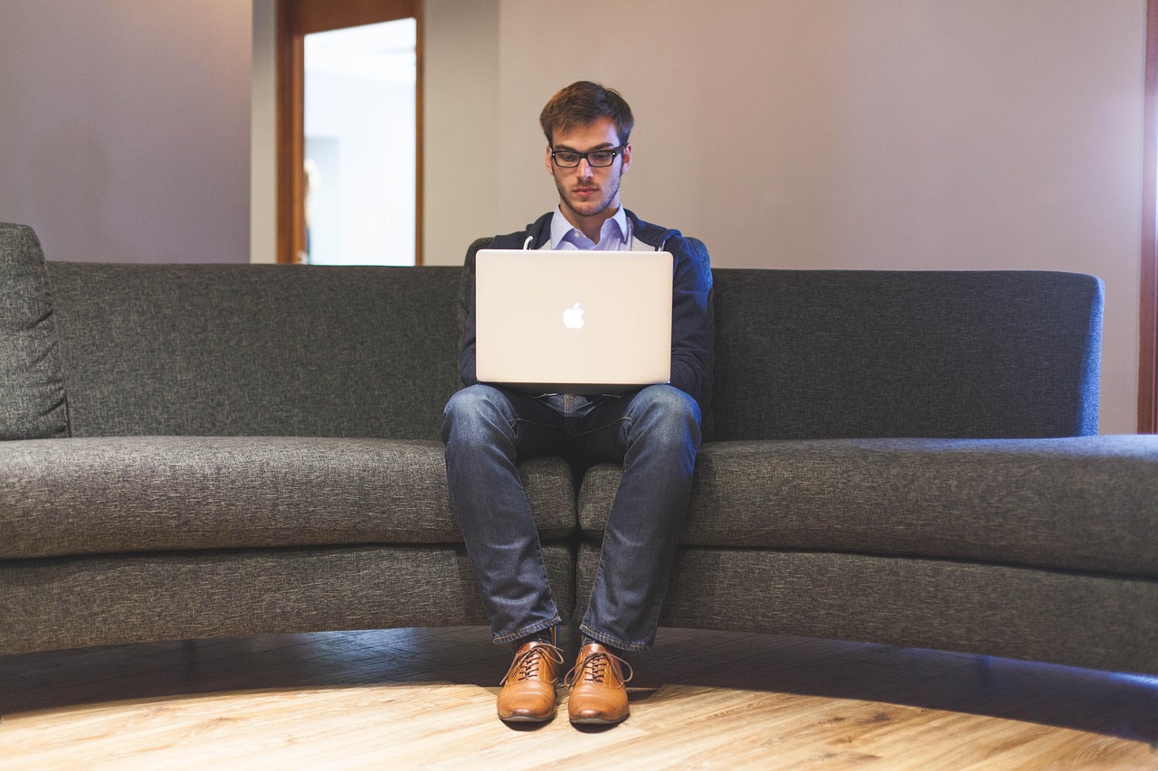Man, laptop, businessman — Optimize resource allocation via commercial construction software
